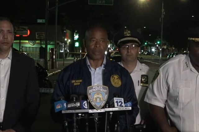 Mayor Eric Adams briefs the media after a shooting in Queens on Sunday night.